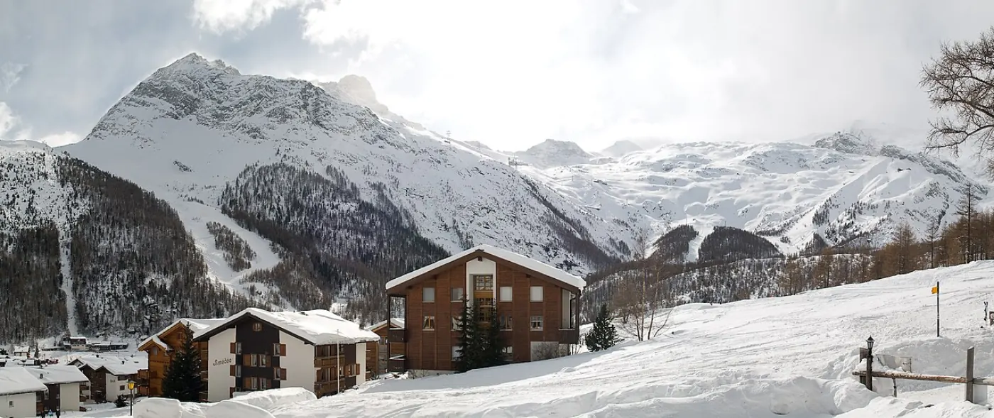 Saas-Fee village street with alpine backdrop